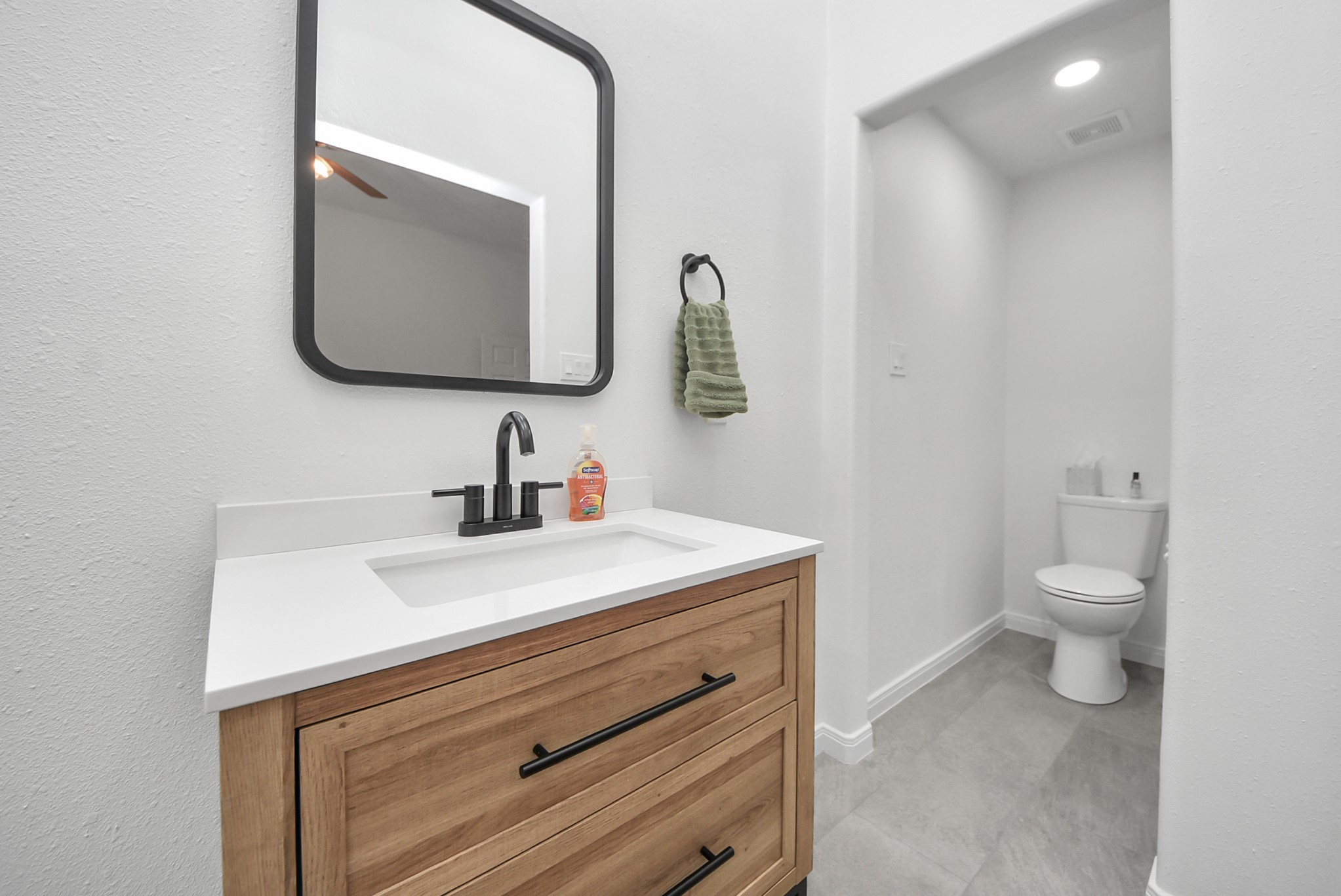 1910 Fox Path Court Katy, TX 77494 - Photo 14 of 29 a bathroom with a sink vanity and mirror