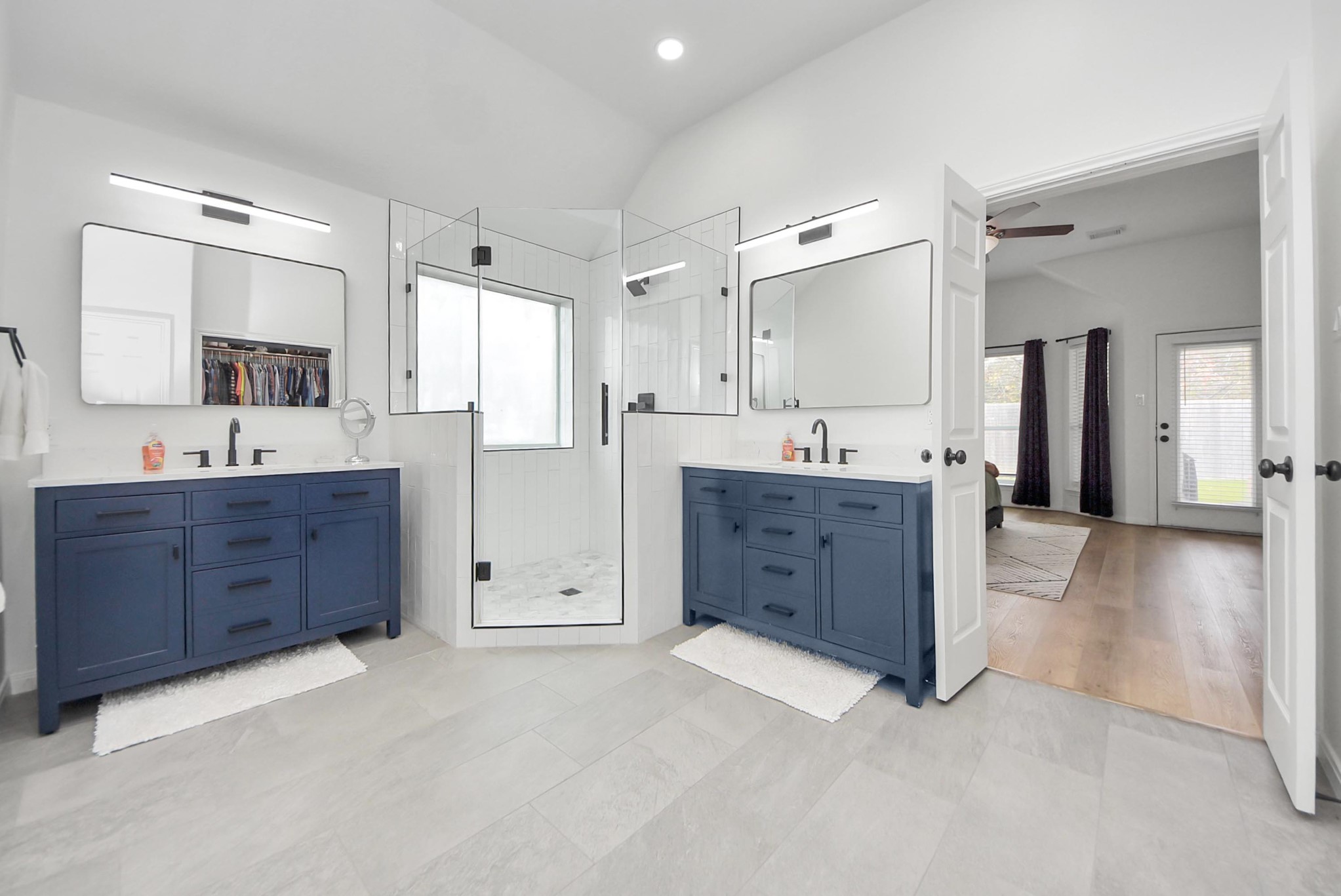1910 Fox Path Court Katy, TX 77494 - Photo 17 of 29 a spacious bathroom with a granite countertop sink mirror and shower