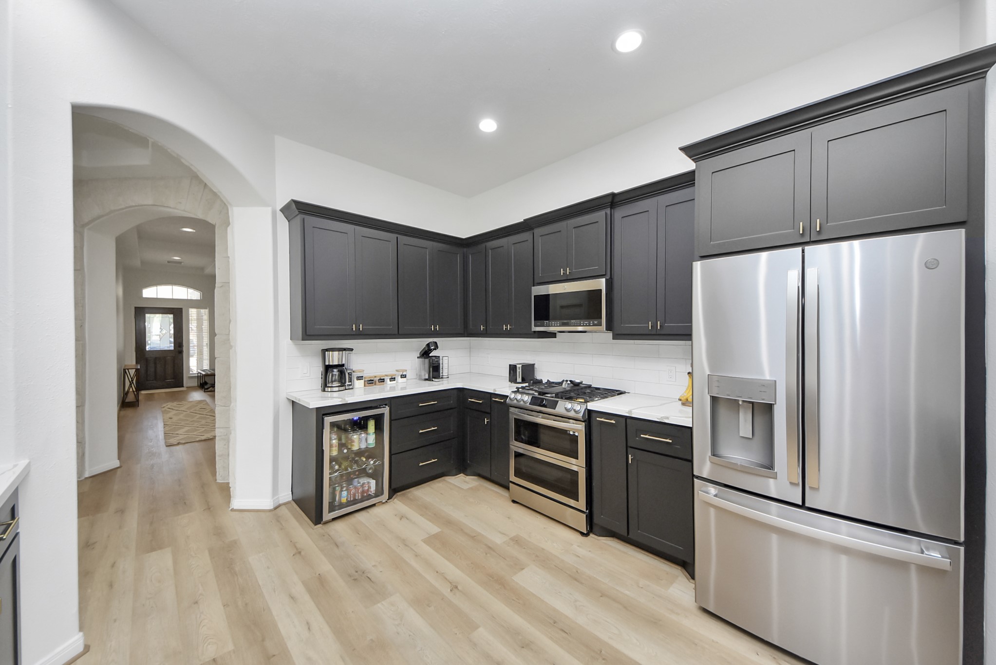 1910 Fox Path Court Katy, TX 77494 - Photo 4 of 29 a kitchen with stainless steel appliances granite countertop a refrigerator stove and sink