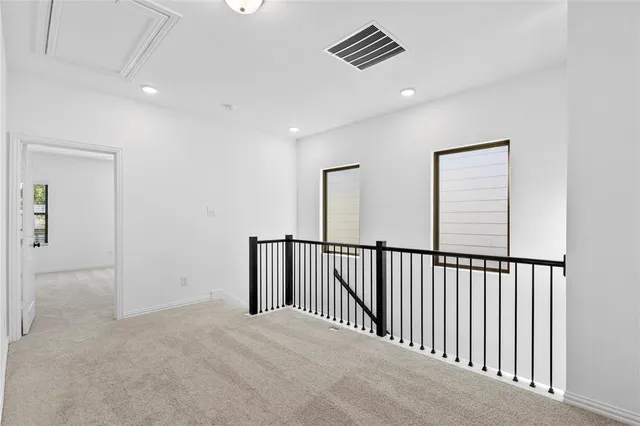 a view of a hallway with windows