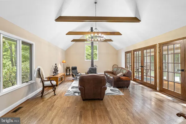 a living room with a couch and wooden floor
