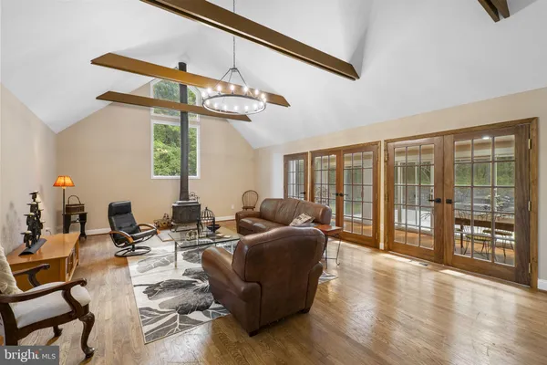 a spacious bedroom with a bed and a window