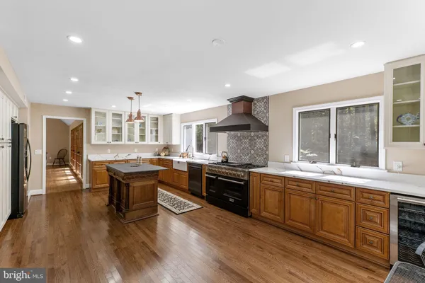 a kitchen with a stove a sink and a refrigerator