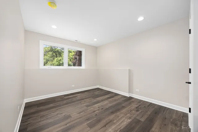 a bathroom with a toilet sink and shower