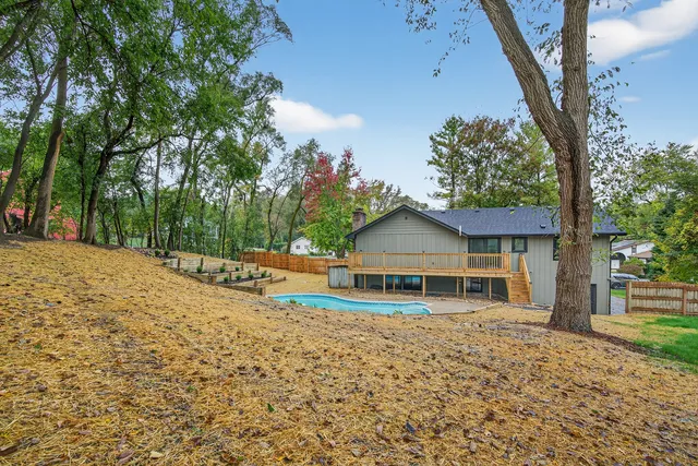 a view of a house with a yard porch and sitting area
