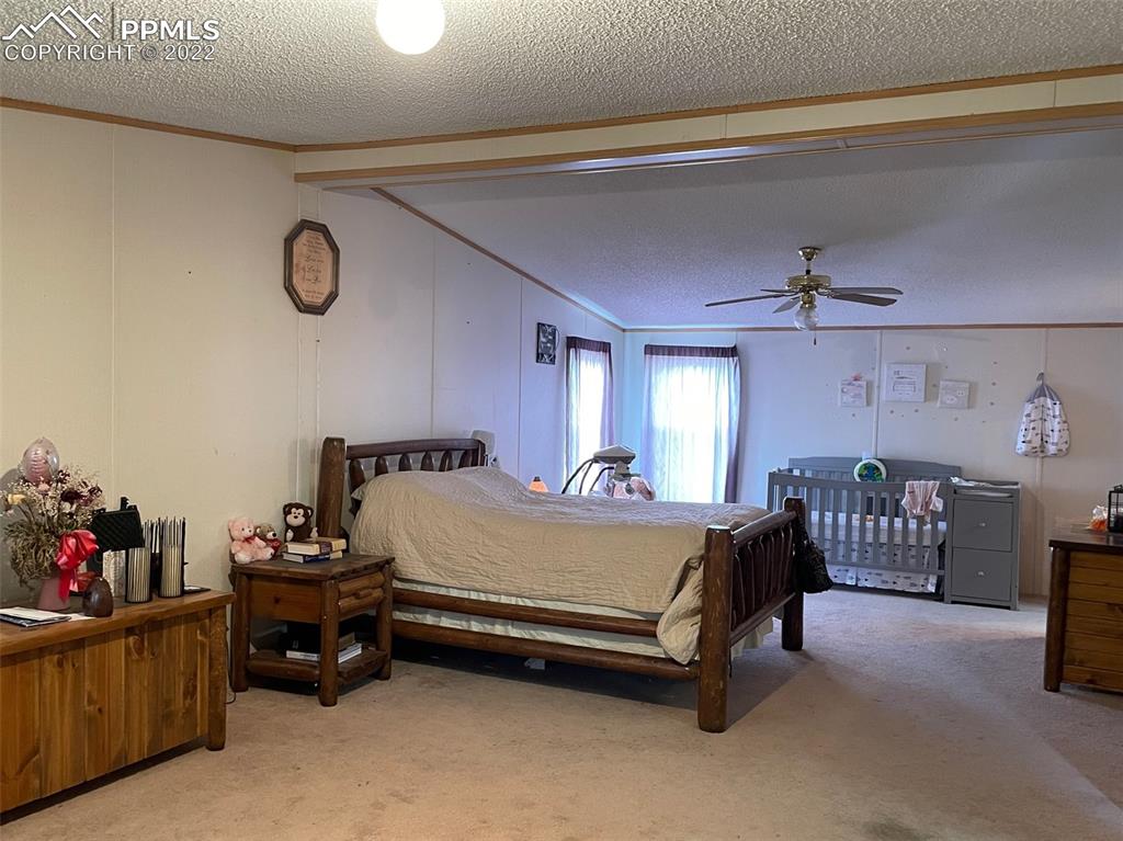 1526 R Path Cotopaxi, CO 81223 - Photo 19 of 30 a bed room with a bed and a table