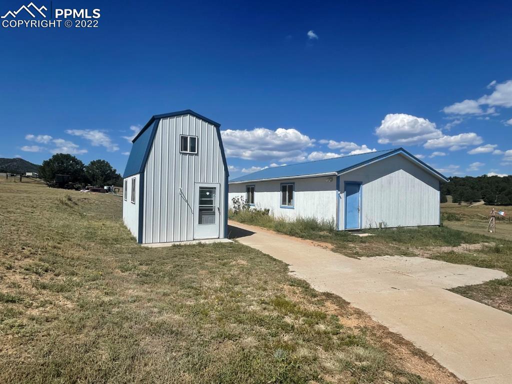 1526 R Path Cotopaxi, CO 81223 - Photo 2 of 30 a front view of a house with a yard