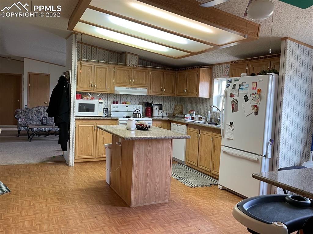 1526 R Path Cotopaxi, CO 81223 - Photo 4 of 30 a kitchen with a sink refrigerator and cabinets