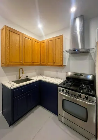 a kitchen with a stove and a sink