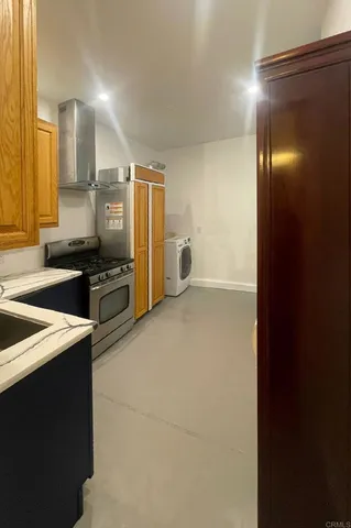 a kitchen with a refrigerator and a sink