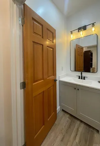 a bathroom with 2 sink and a mirror