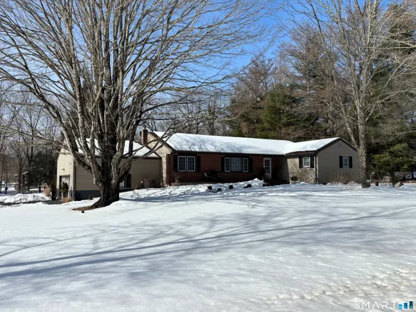 a view of a yard with snow on the road