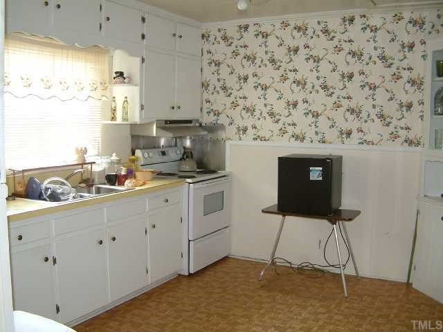 5780 Brogden Road Smithfield, NC 27577 - Photo 8 of 12 Kitchen with white cabinents.