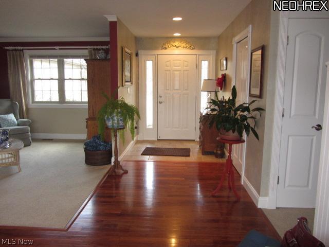 3839 Sandy Lake Road Ravenna, OH 44266 - Photo 4 of 23 The foyer welcomes you with gleaming Cherry floors a living room and formal dining area.