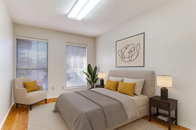 a bedroom with a bed and a couch