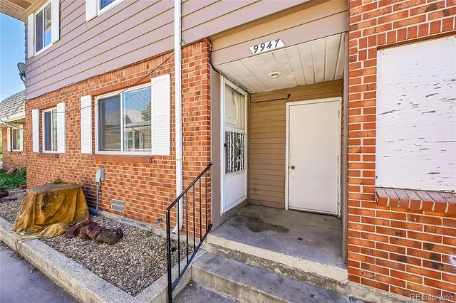 a front view of a house with parking area