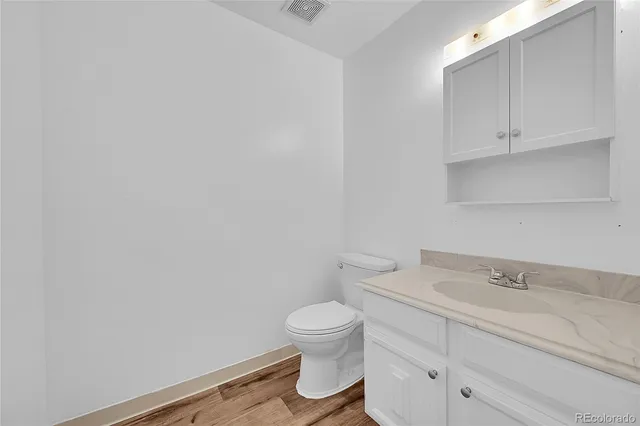 a bathroom with a toilet and a sink