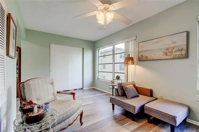 a bedroom with furniture and a window