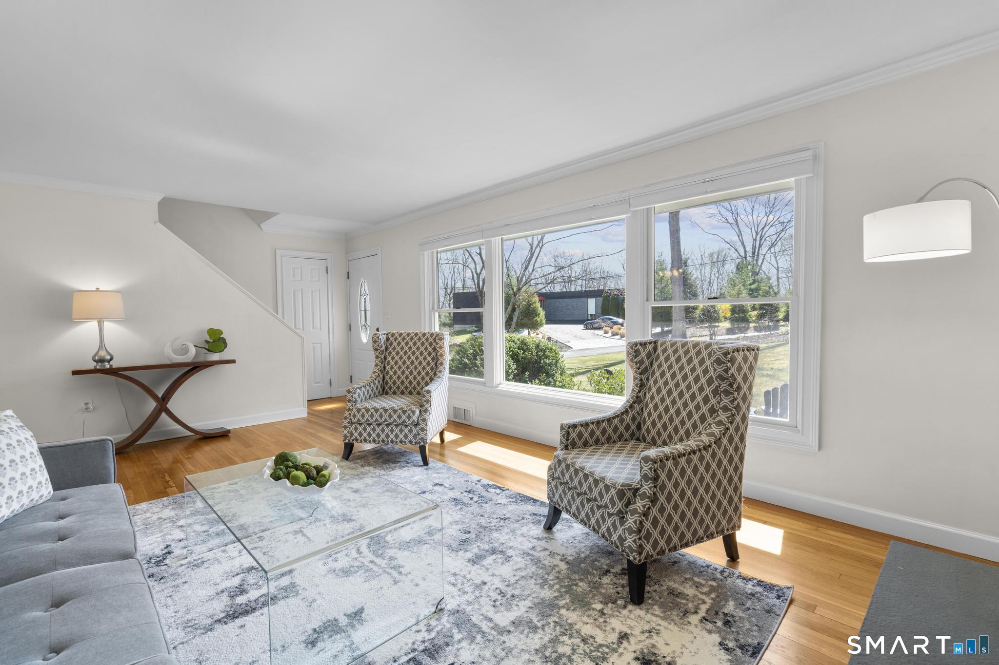 18 Edith Lane Wilton, CT 06897 - Photo 5 of 35 a living room with furniture and a table