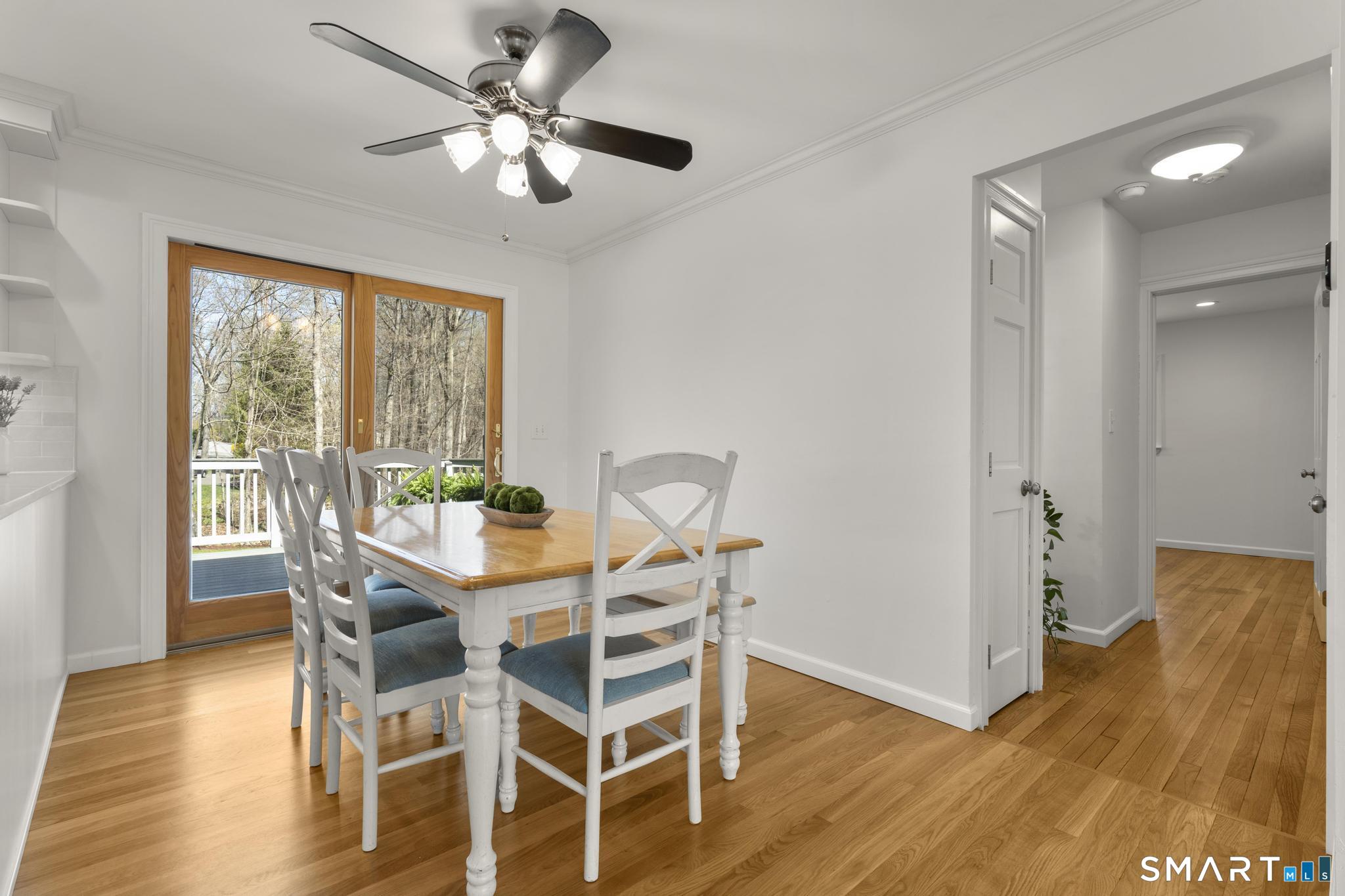 18 Edith Lane Wilton, CT 06897 - Photo 6 of 35 a view of a dining room with furniture window and wooden floor