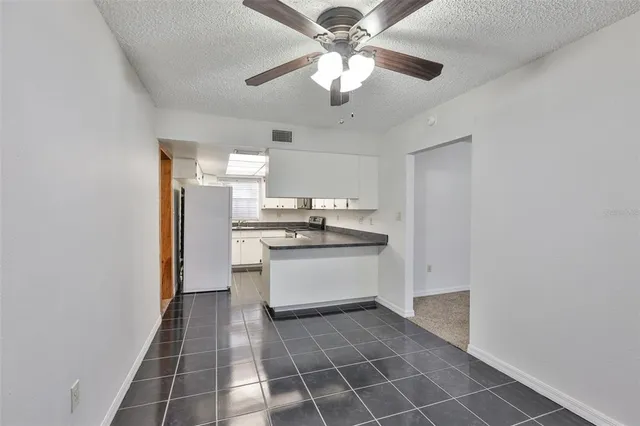 a kitchen with stainless steel appliances a sink and cabinets