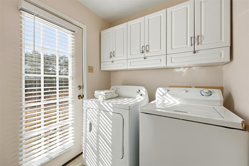 892 Hcr 1227 Whitney, TX 76692 - Photo 16 of 40 a utility room with dryer and washer