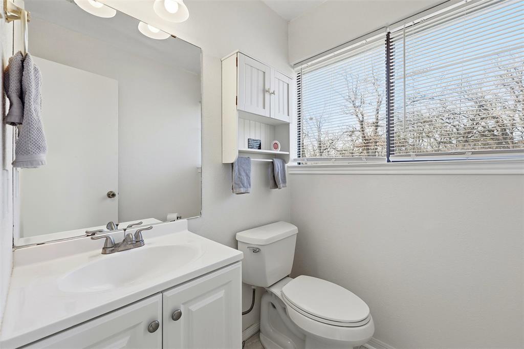 892 Hcr 1227 Whitney, TX 76692 - Photo 17 of 40 a bathroom with a sink a toilet and a mirror