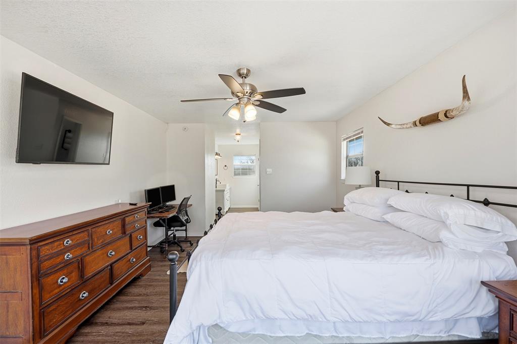892 Hcr 1227 Whitney, TX 76692 - Photo 20 of 40 a bedroom with a bed and a flat screen tv
