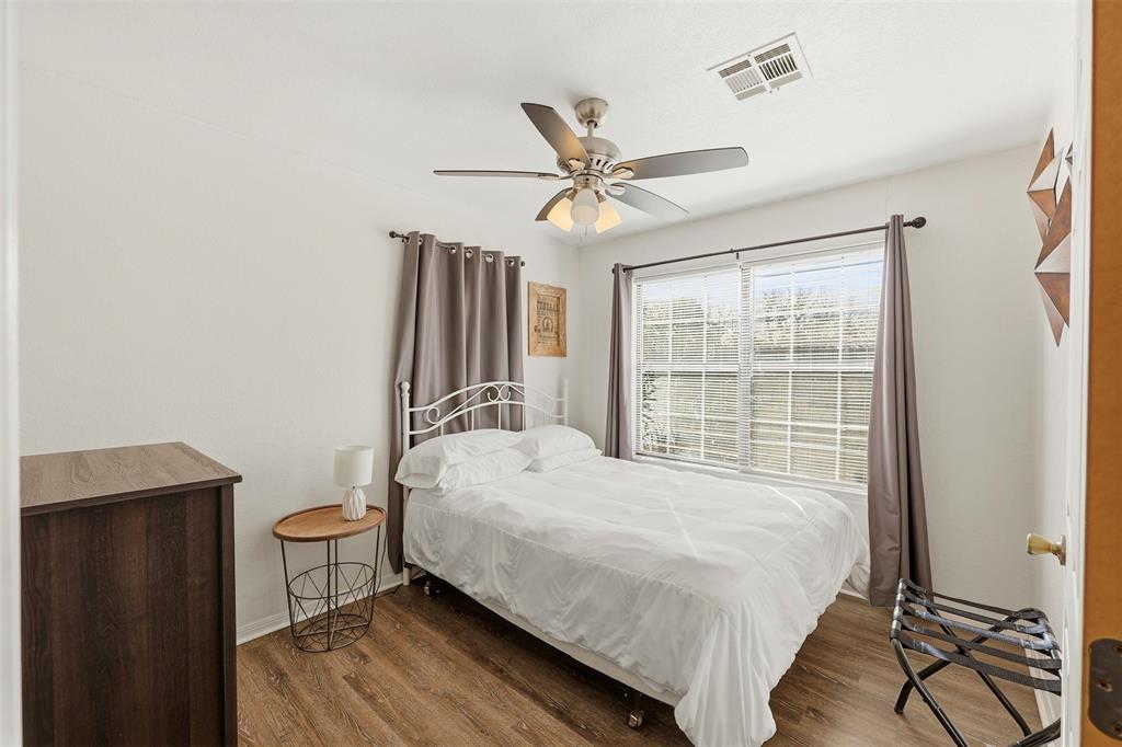 892 Hcr 1227 Whitney, TX 76692 - Photo 22 of 40 a bedroom with a bed dresser and a window