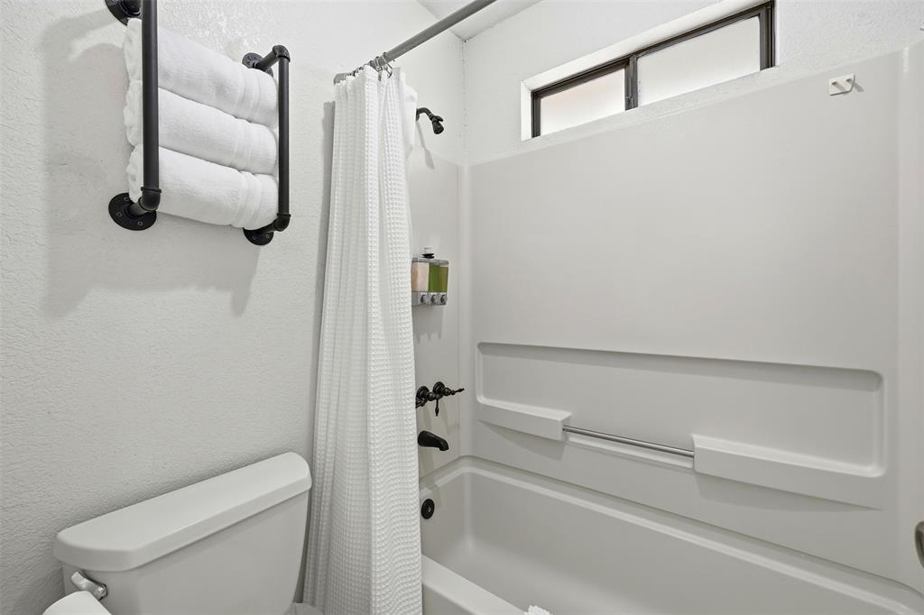 892 Hcr 1227 Whitney, TX 76692 - Photo 23 of 40 a bathroom with a shower and toilet