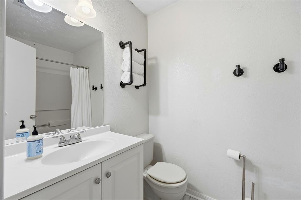 892 Hcr 1227 Whitney, TX 76692 - Photo 26 of 40 a bathroom with a sink a toilet and shower