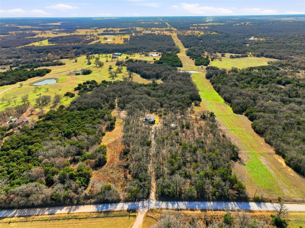 892 Hcr 1227 Whitney, TX 76692 - Photo 40 of 40 an aerial view of residential houses with outdoor space