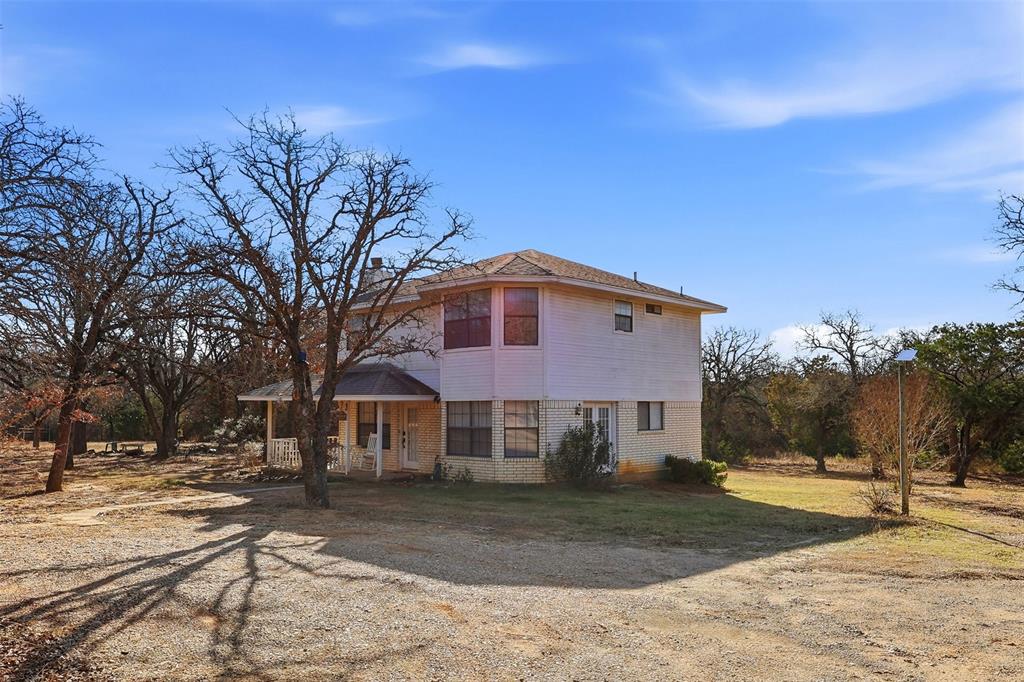 892 Hcr 1227 Whitney, TX 76692 - Photo 4 of 40 a front view of a house with a yard