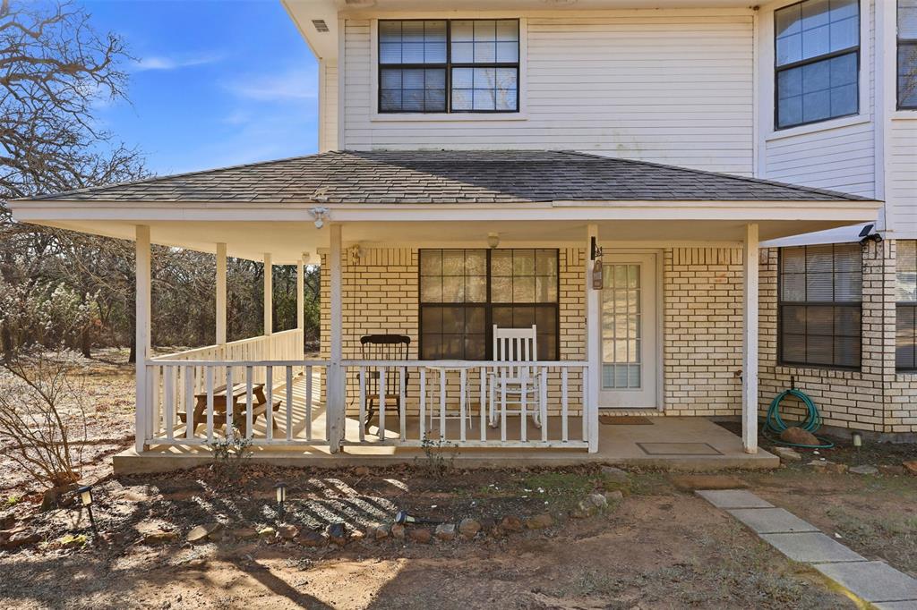 892 Hcr 1227 Whitney, TX 76692 - Photo 5 of 40 a front view of a house with a fence