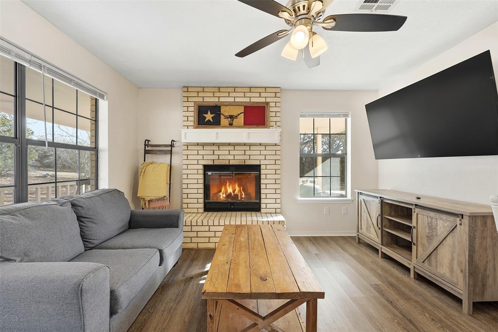 892 Hcr 1227 Whitney, TX 76692 - Photo 10 of 40 a living room with furniture fireplace and flat screen tv