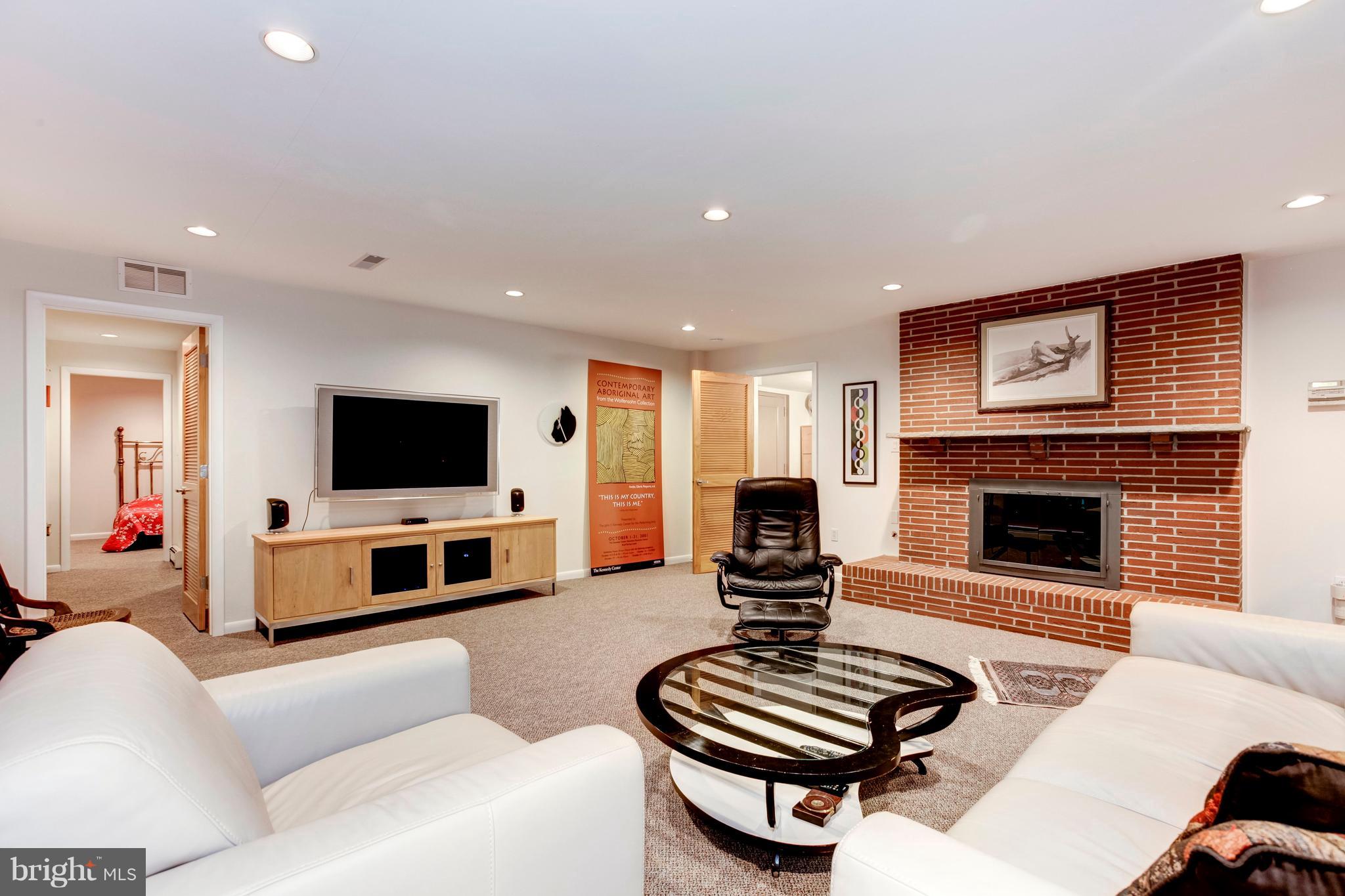 3309 Brooklawn Terrace Chevy Chase, MD 20815 - Photo 20 of 25 Lower Level Family Room with Gas Fireplace