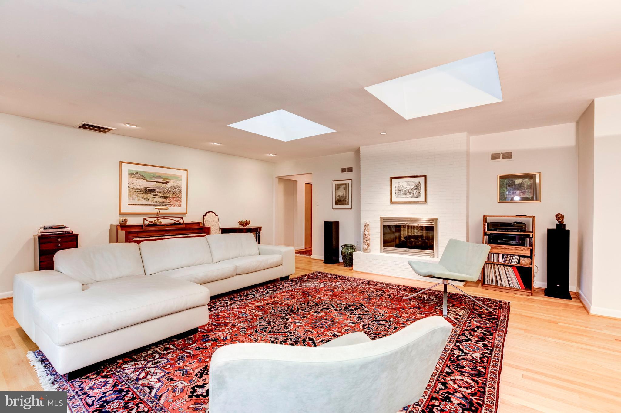 3309 Brooklawn Terrace Chevy Chase, MD 20815 - Photo 3 of 25 Living Room with Gas Fireplace & Skylights