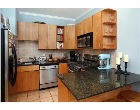 43 East Springfield Street, Unit 4 Boston, MA 02118 - Photo 2 of 6 a kitchen with a stove a sink and a microwave