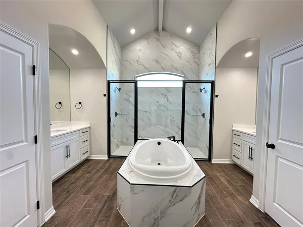 a bathroom with a bathtub and a sink