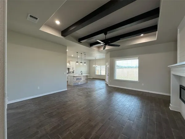 a view of a livingroom with wooden floor