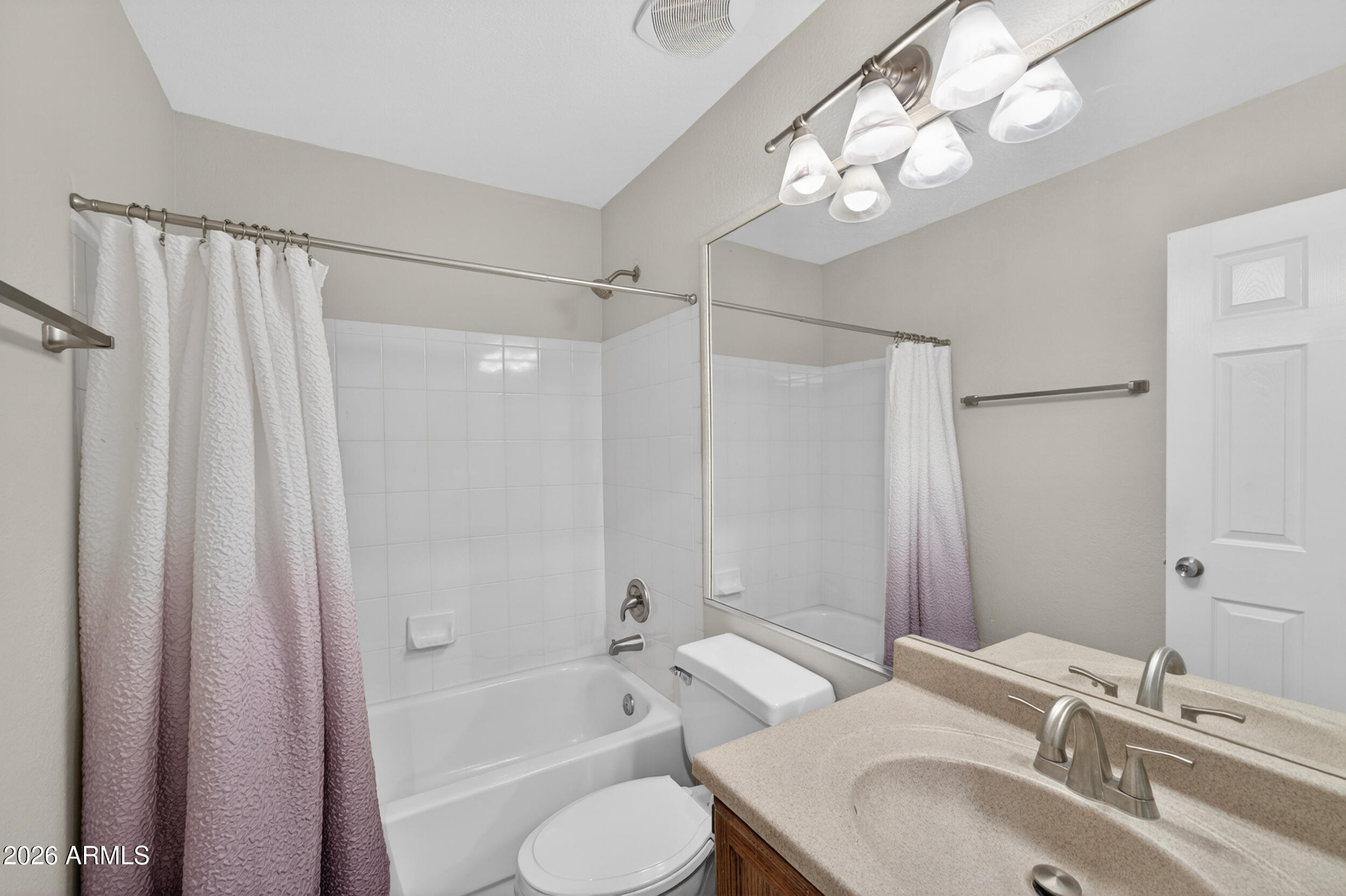 4729 West Monterey Street Chandler, AZ 85226 - Photo 28 of 50 a bathroom with a granite countertop sink a toilet and shower