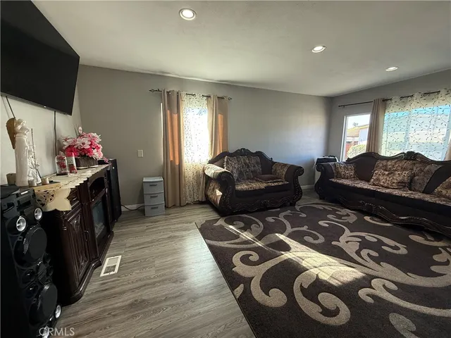 a view of a dining room with furniture and window