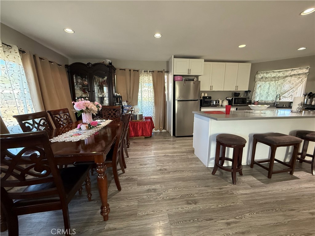 2601 East Victoria Street, Unit 404 Compton, CA 90220 - Photo 12 of 30 a view of a dining room with furniture and window