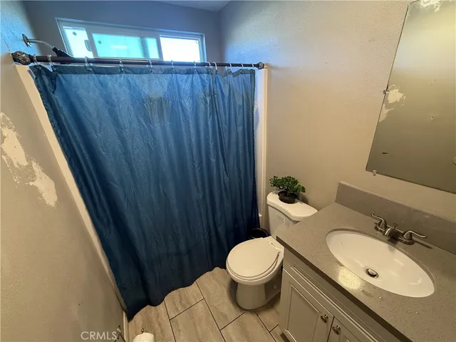 a bathroom with a sink and toilet