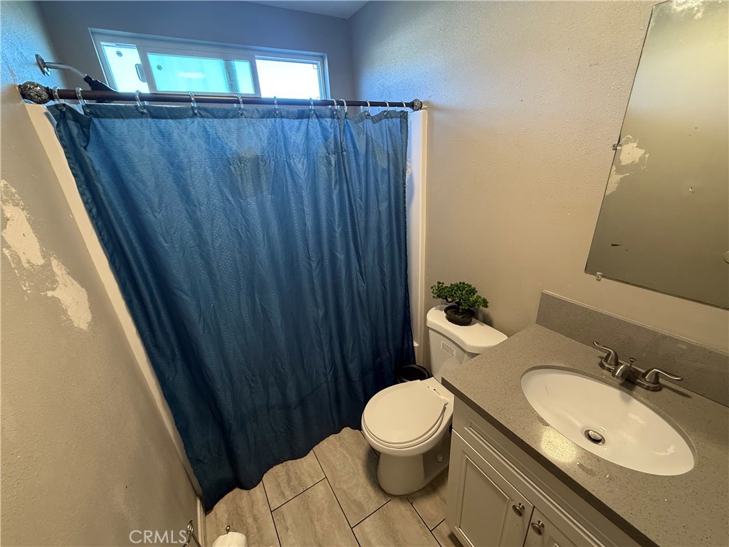 2601 East Victoria Street, Unit 404 Compton, CA 90220 - Photo 28 of 30 a bathroom with a sink and a toilet