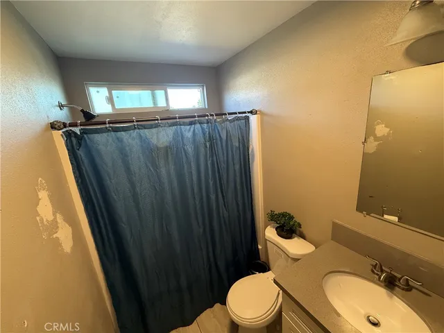 a room with furniture and a flat screen tv