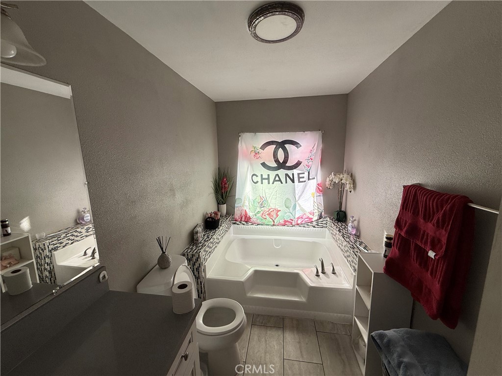 2601 East Victoria Street, Unit 404 Compton, CA 90220 - Photo 30 of 30 a room with furniture and a flat screen tv