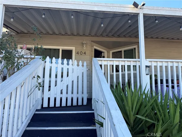 a view of a backyard with wooden fence