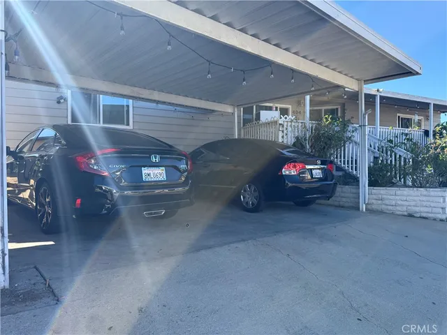 a view of a garage and car parked