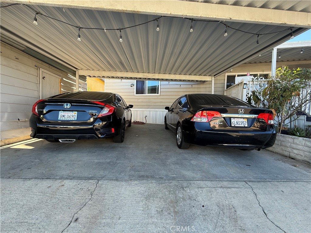 2601 East Victoria Street, Unit 404 Compton, CA 90220 - Photo 7 of 30 a view of a garage and car parked